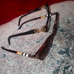 Two pairs of frames one Burberry one Gucci